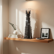 Black tower model inside a clear acrylic display case on a white background