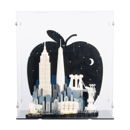 Model of a city skyline with a large apple in the background in an acrylic display box
