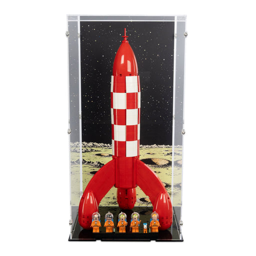A red and white checkered lego tintin toy rocket displayed inside a clear acrylic vertical case with a black space-themed backdrop 
