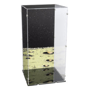 A clear acrylic display case with printed space-themed panels, featuring a black starry sky on the back and a gray cratered lunar surface on the front