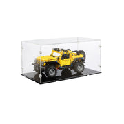 Yellow toy lego jeep in a clear display case on a black acrylic base
