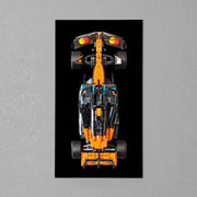 LEGO Technic McLaren F1 car mounted on a room wall black acryllc board