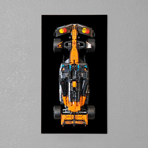 LEGO Technic McLaren F1 car mounted on a room wall black acryllc board