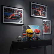 premium f1 display case with ferrari helmets in an f1 dark room