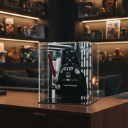 Darth Vader lego minifigure in a printed display case on a wooden surface with a cozy room background.
