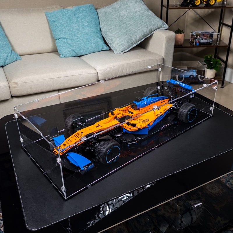 lego mclaren f1 car model in a display case in a living room setting