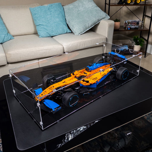 lego mclaren f1 car model in a display case in a living room setting